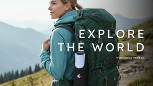 Outdoor adventurer using AQUA VAULT smart water bottle technology for hydration on a scenic mountain hike