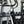 AQUA VAULT White Water Bottle with a bottle sleeve attached to an elliptical machine in a gym setting