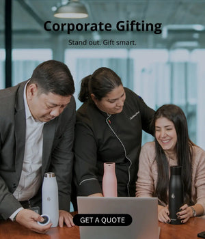 Three people looking at a laptop with promotional text for AQUA  VAULT corporate gifting.