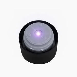 Black AquaVault PureX bottle cap with glowing UV-C light on white background
