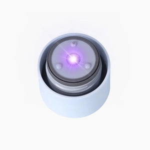 AQUA VAULT PureX Bottle Cap Tidal Blue with glowing UV-C light on white background