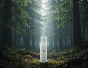 Aqua Vault PureX white water bottle with a logo in a forest setting